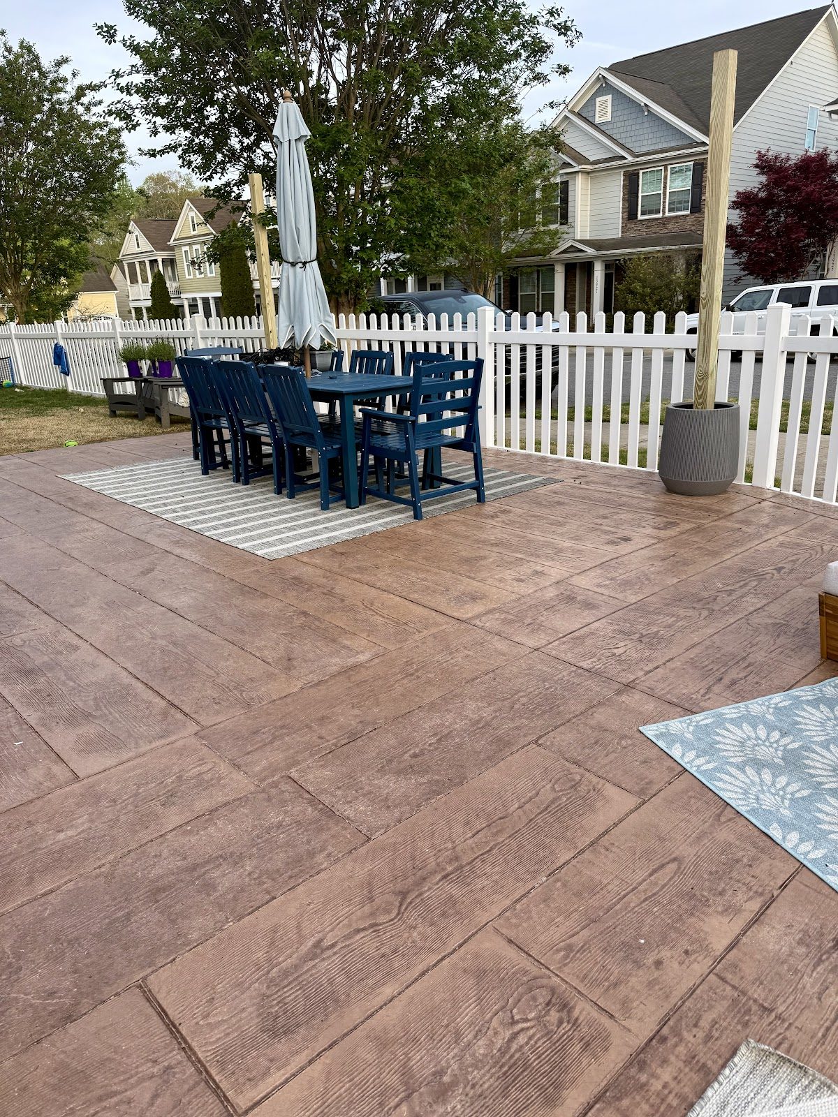 Stamped wood-plank concrete patio in a neighborhood backyard