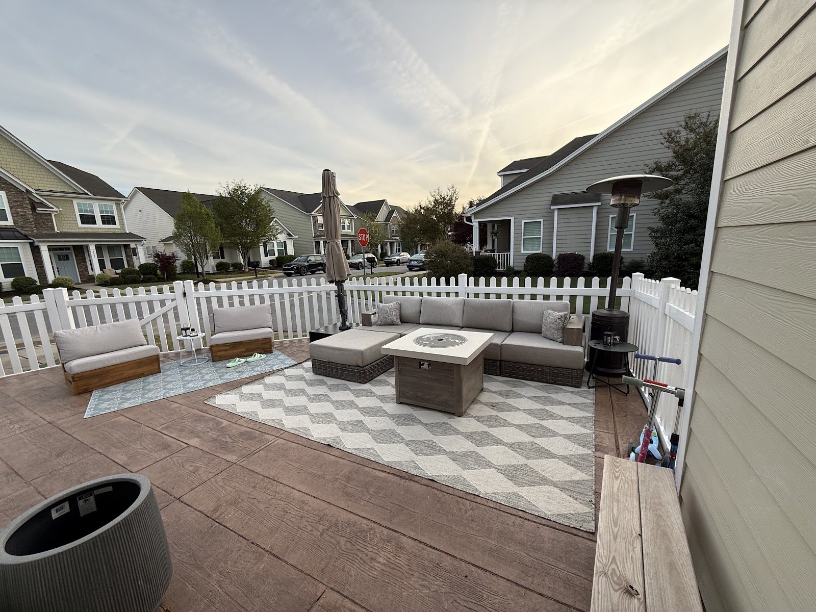 Stamped wood-plank concrete patio arranged as an outdoor room