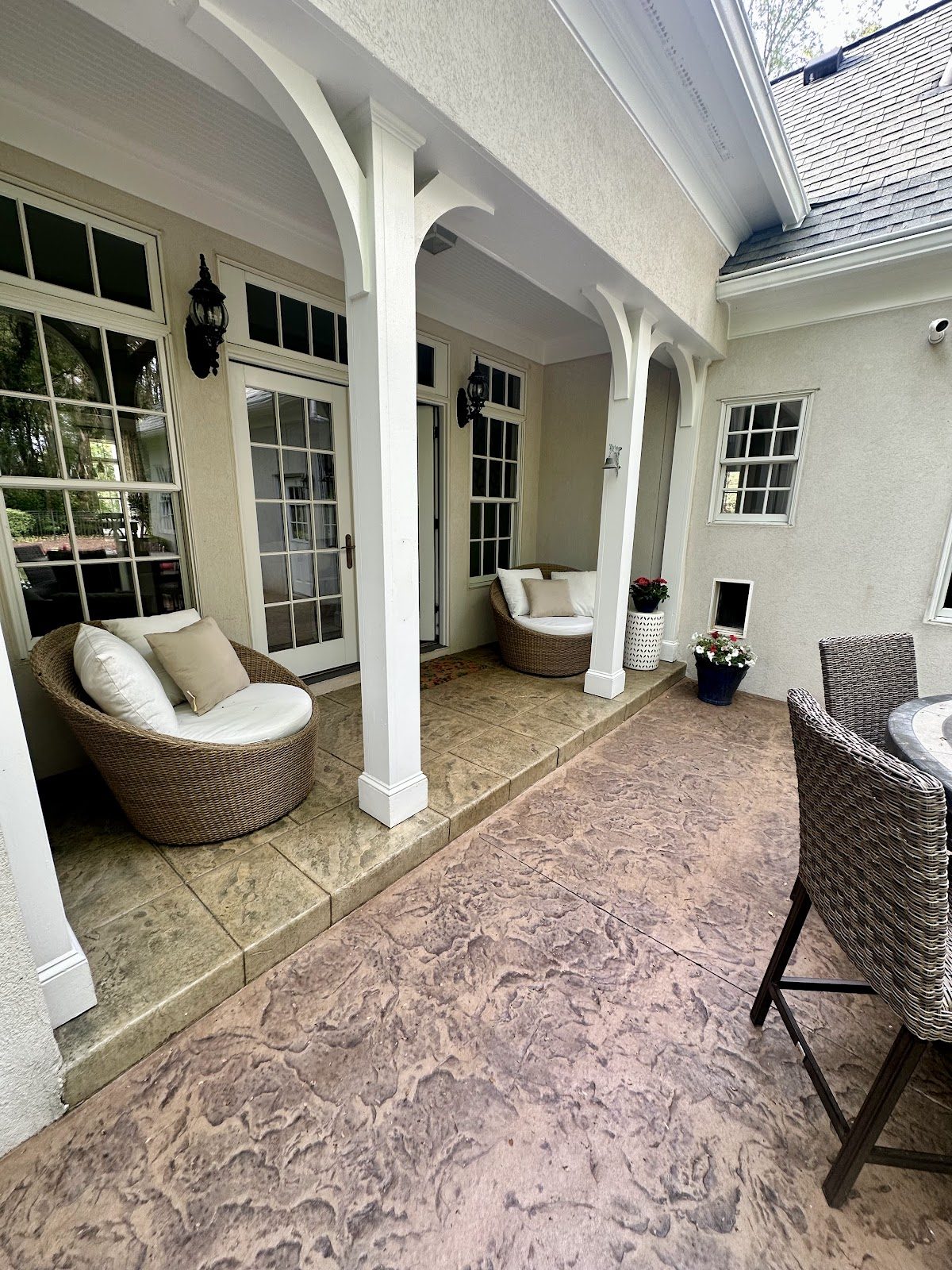 Textured stamped concrete floor under a covered porch